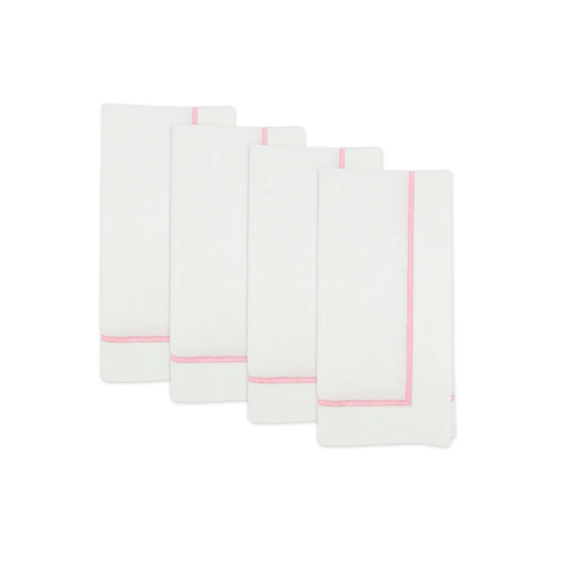 Set of four white napkins with pink hemlines on a white background