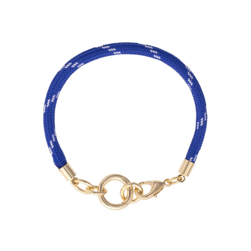 Blue bracelet with gold clasp on a white background