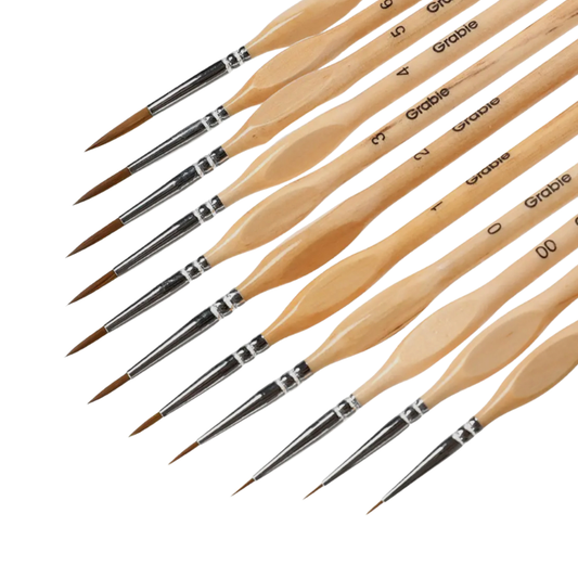 Set of Grable paintbrushes with wooden handles on a white background