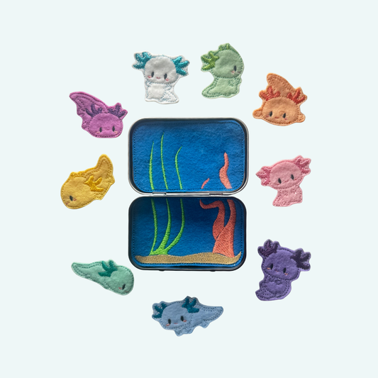 Colorful embroidered patches of sea creatures on a white background