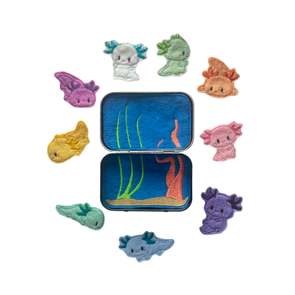 Set of colorful sea creature-themed patches around a tin with an underwater scene.