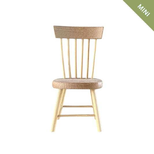 Wooden chair with wicker backrest on a white background