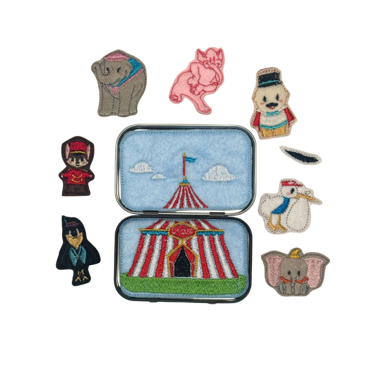 Set of circus-themed embroidered patches on a white background