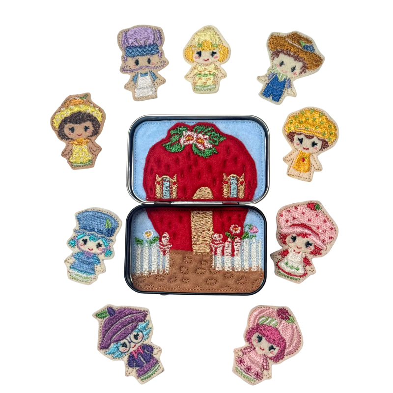 Set of embroidered characters around a tin with a red house design on a white background