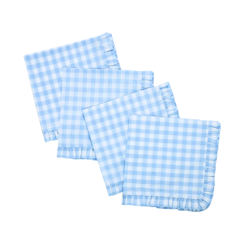 Set of four blue and white checkered napkins on a white background
