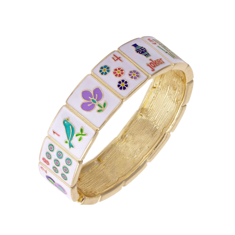Gold bracelet with colorful enameled charms on a white background