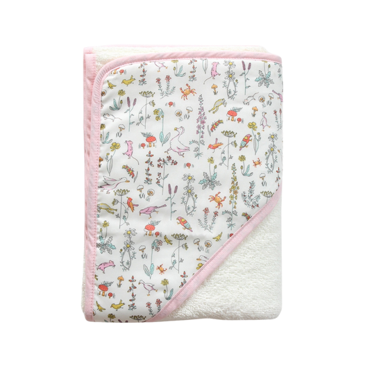 Baby towel with Liberty of London animal and floral pattern on a white background