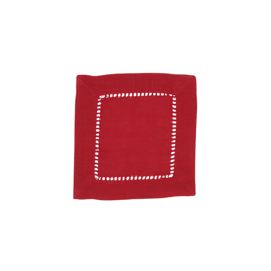 Red napkin with white stitching on a white background