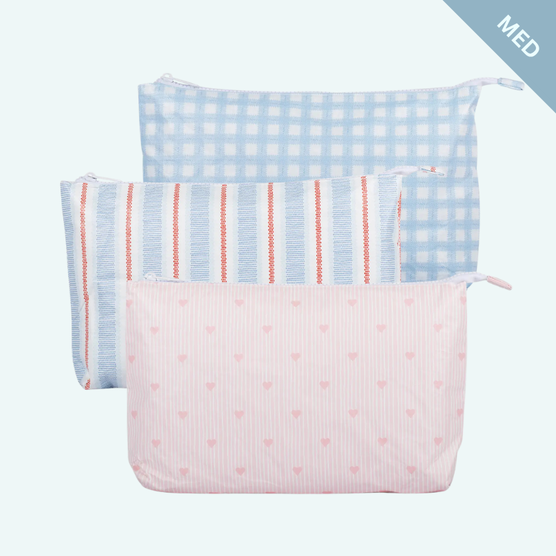 Three pouches with different patterns on a light blue background