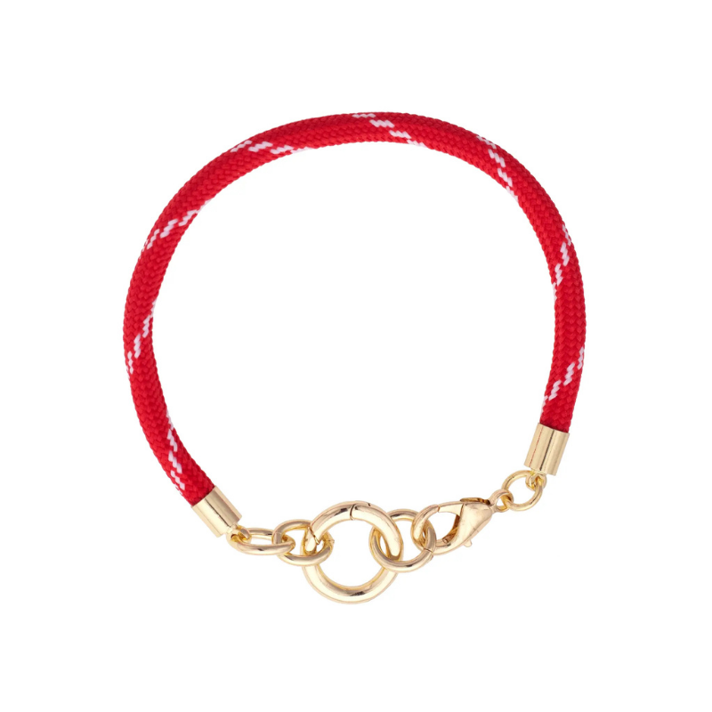 Red bracelet with gold clasp on a white background