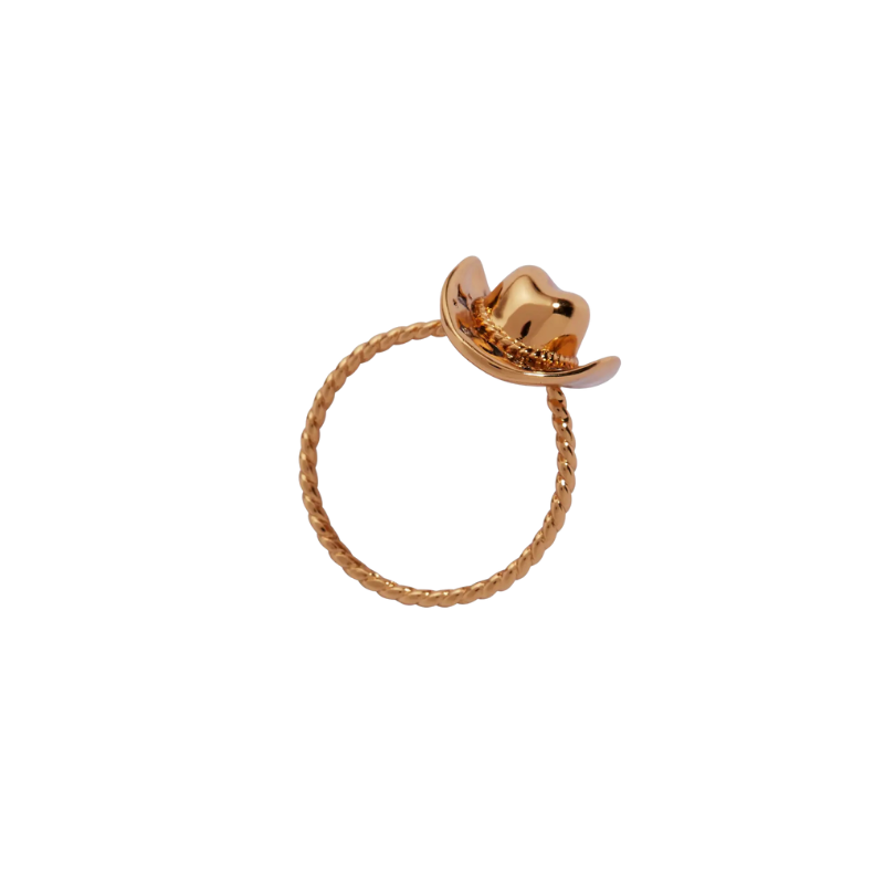 Gold ring with a small cowboy hat on a white background